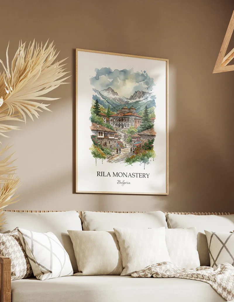 A gorgeous boho-inspired living space with a framed vintage travel poster of Rila Monastery in Bulgaria on display.