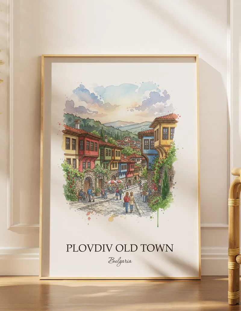 Minimalist poster of Plovdiv Old Town in Bulgaria in a light frame standing on the floor in a dark moody interior.