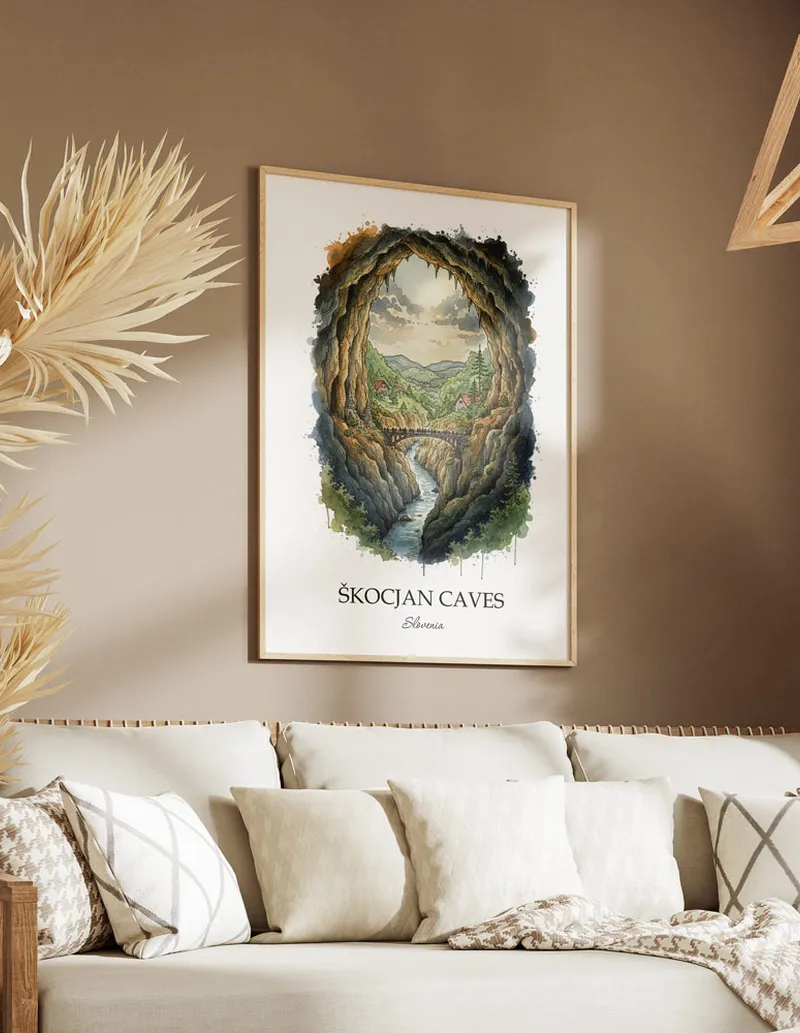 A gorgeous boho-inspired living space with a framed vintage travel poster of _kocjan Caves in Slovenia on display.