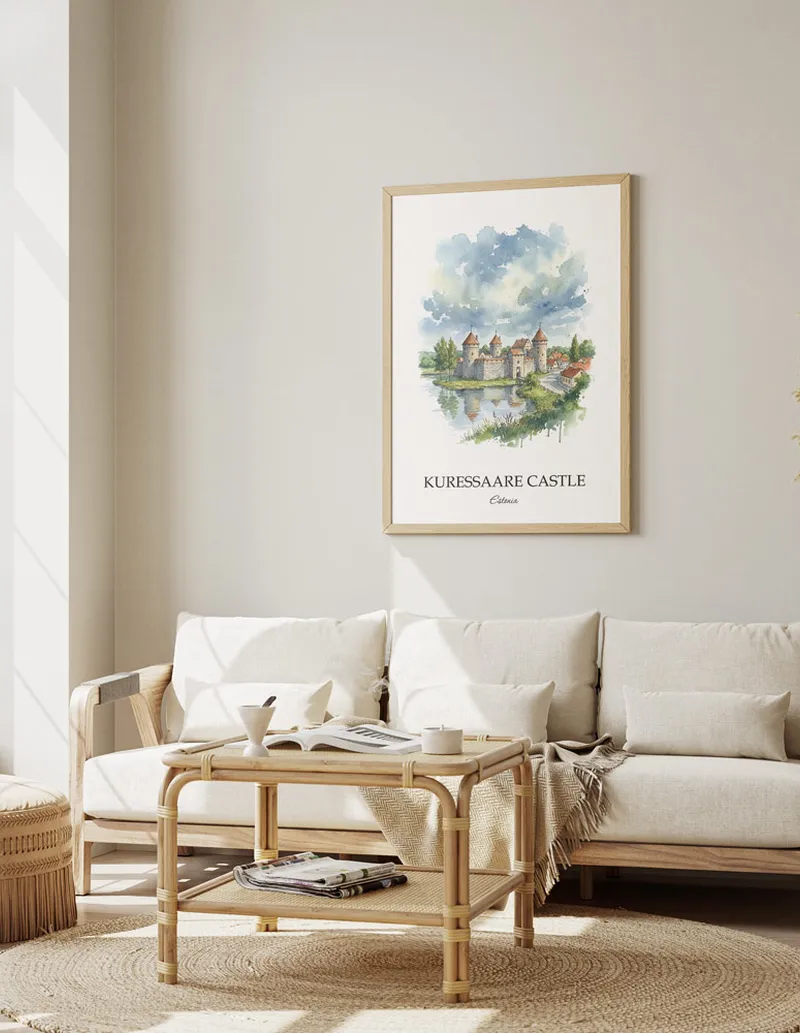 Vintage travel poster of Kuressaare Castle, Estonia in a light frame displayed above a sofa in a bright boho interior.