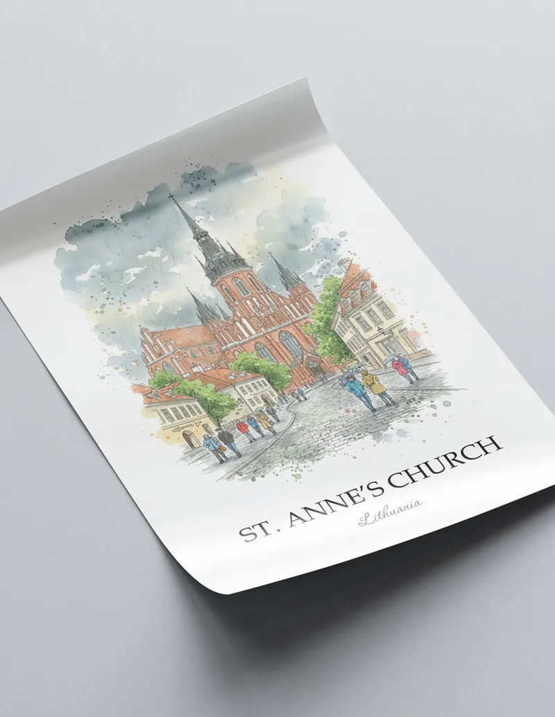 Framed wall art featuring St. Anne's Church in Lithuania in a light wood frame leaning on the floor.