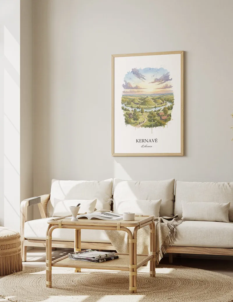 Vintage travel poster of Kernav_, Lithuania in a light frame displayed above a sofa in a bright boho interior.