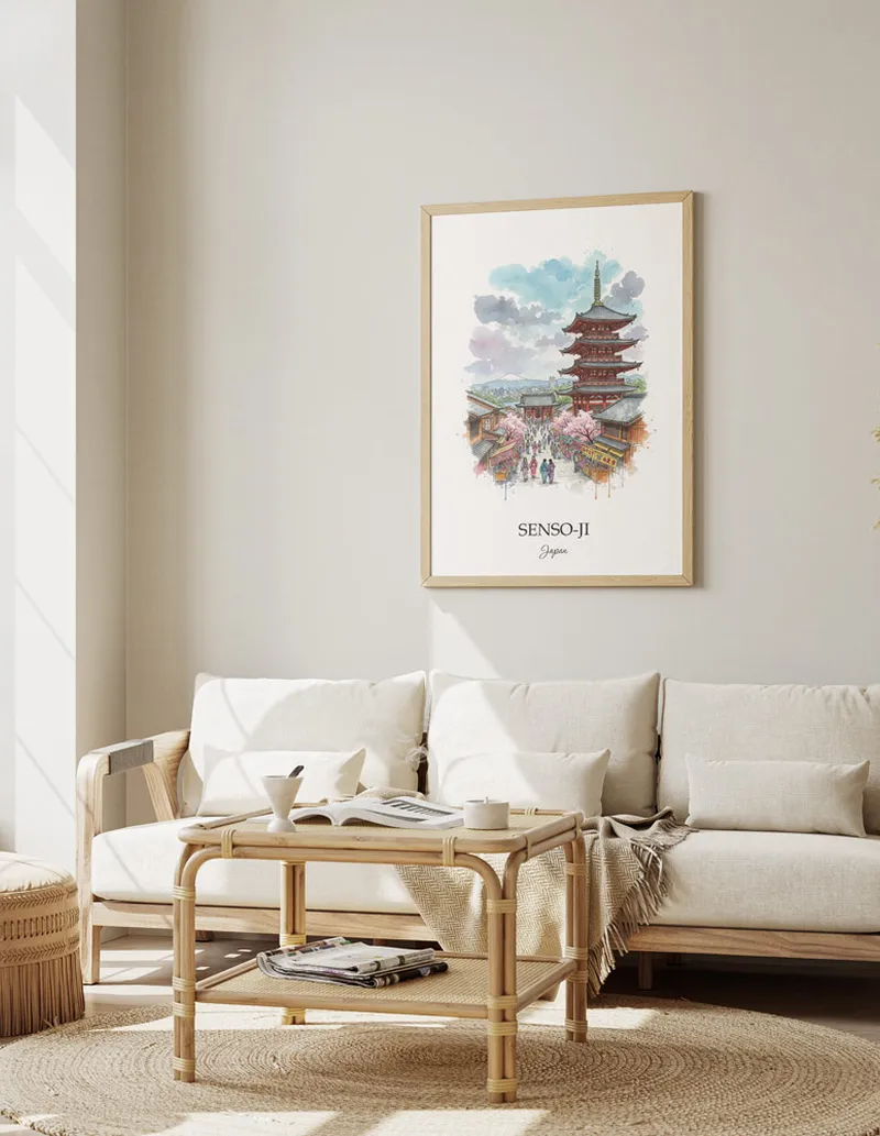 Vintage travel poster of Senso-ji, Japan in a light frame displayed above a sofa in a bright boho interior.
