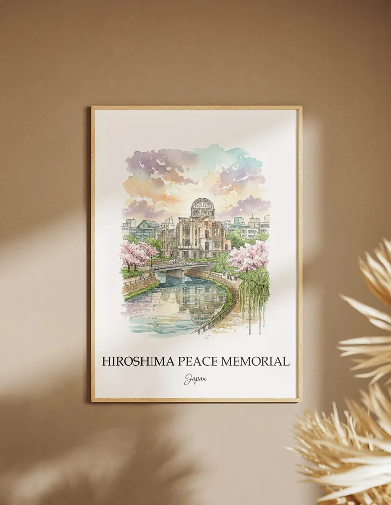 Cozy, well-lit workspace with a minimalist poster of Hiroshima Peace Memorial, Japan in a light frame sitting on the desk.