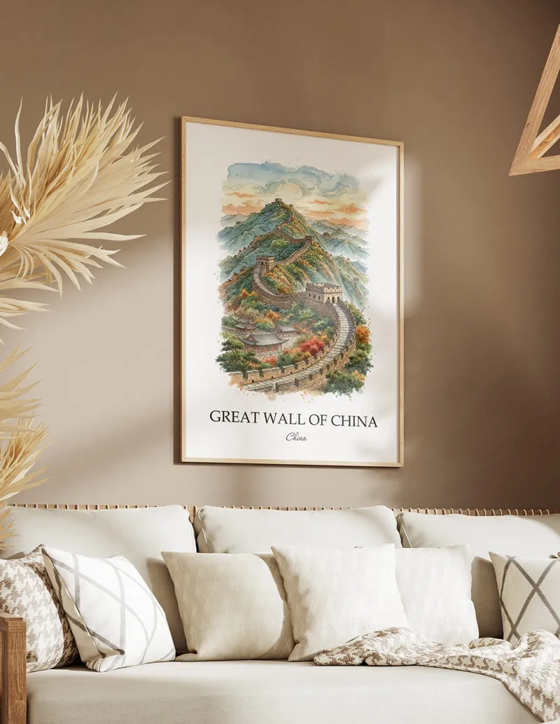 Framed wall art featuring Great Wall of China, China in a light wood frame hanging above a sofa in a modern living room.