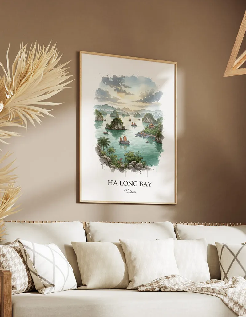 Framed wall art featuring Ha Long Bay, Vietnam in a light wood frame hanging above a sofa in a modern living room.