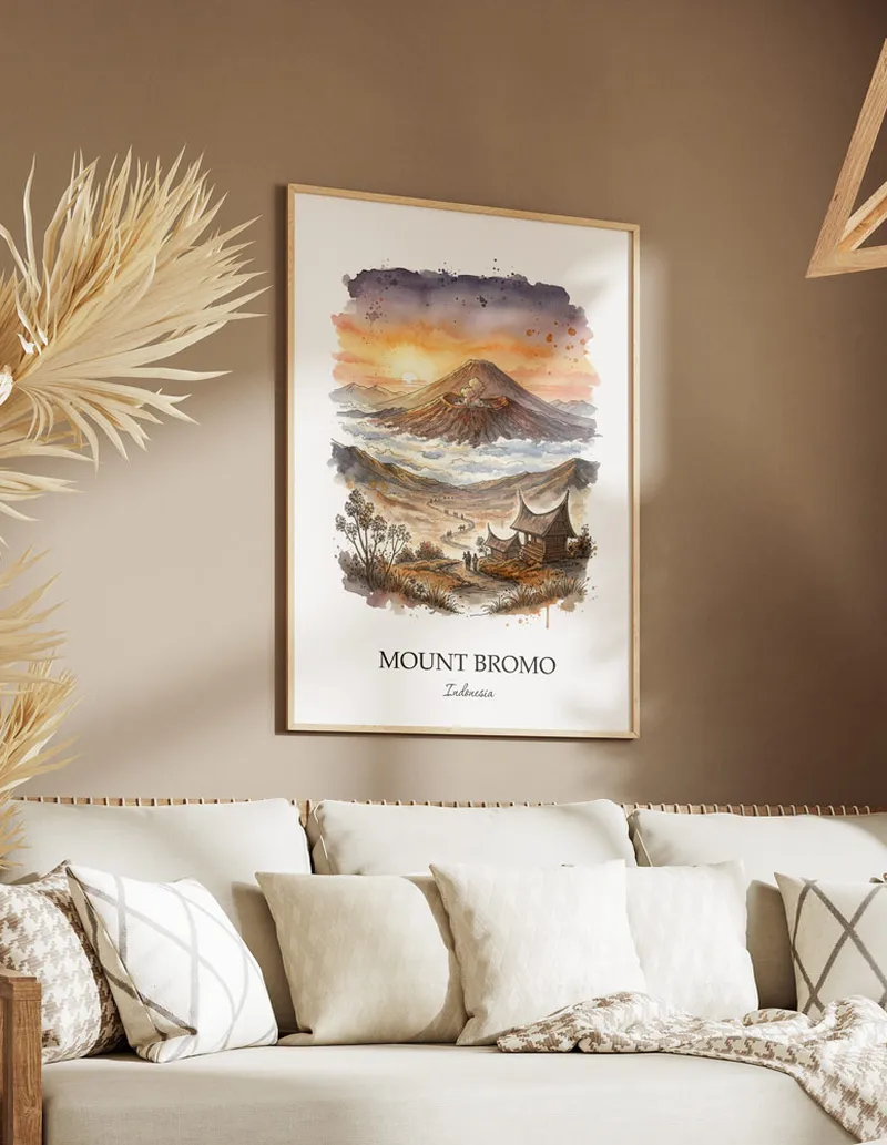 Framed wall art featuring Mount Bromo, Indonesia in a light wood frame hanging above a sofa in a modern living room.