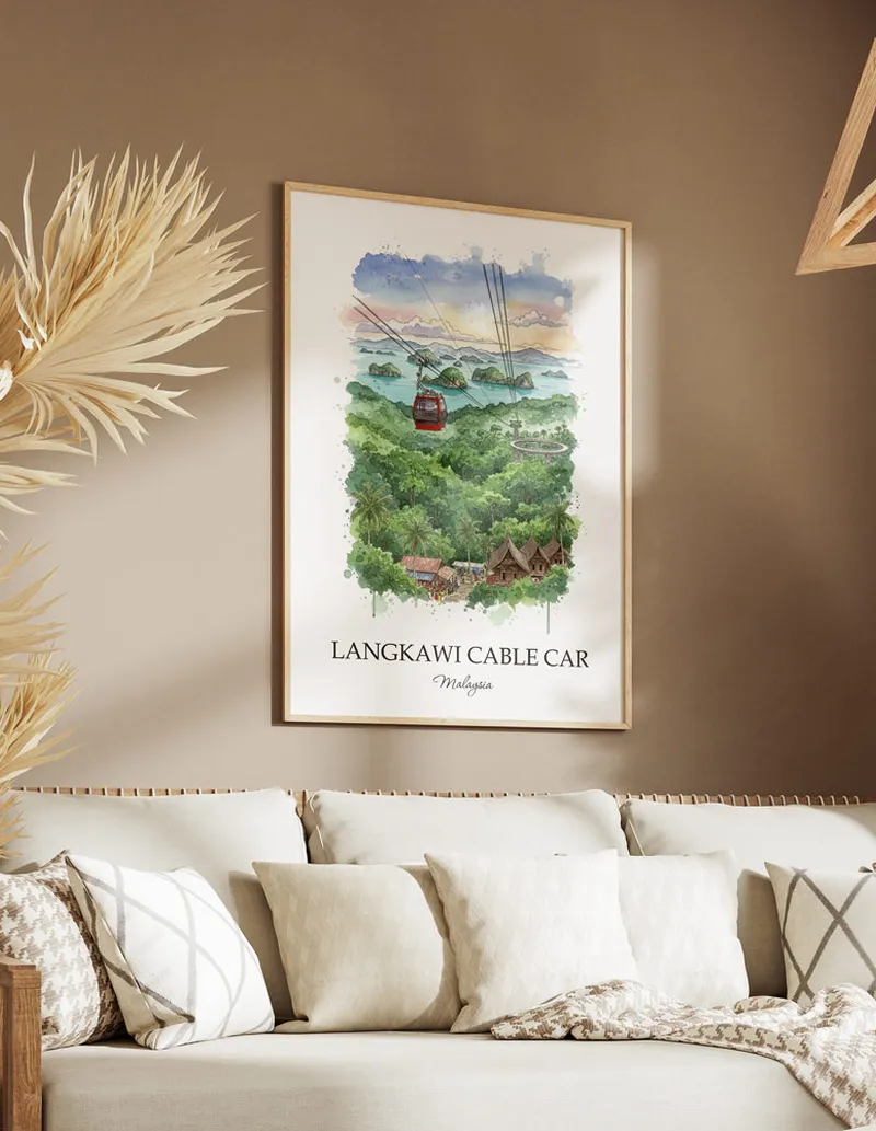 Framed wall art featuring Langkawi Cable Car, Malaysia in a light wood frame hanging above a sofa in a modern living room.