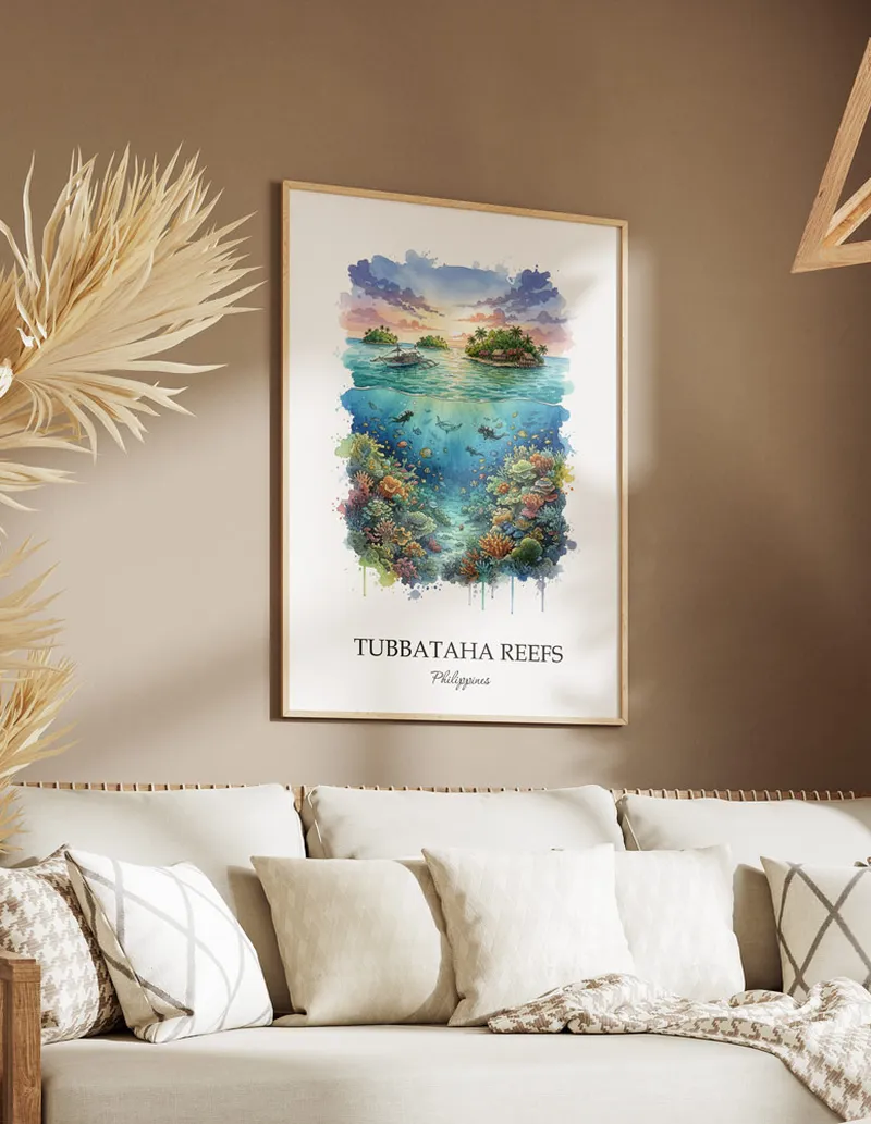 Framed wall art featuring Tubbataha Reefs, Philippines in a light wood frame hanging above a sofa in a modern living room.