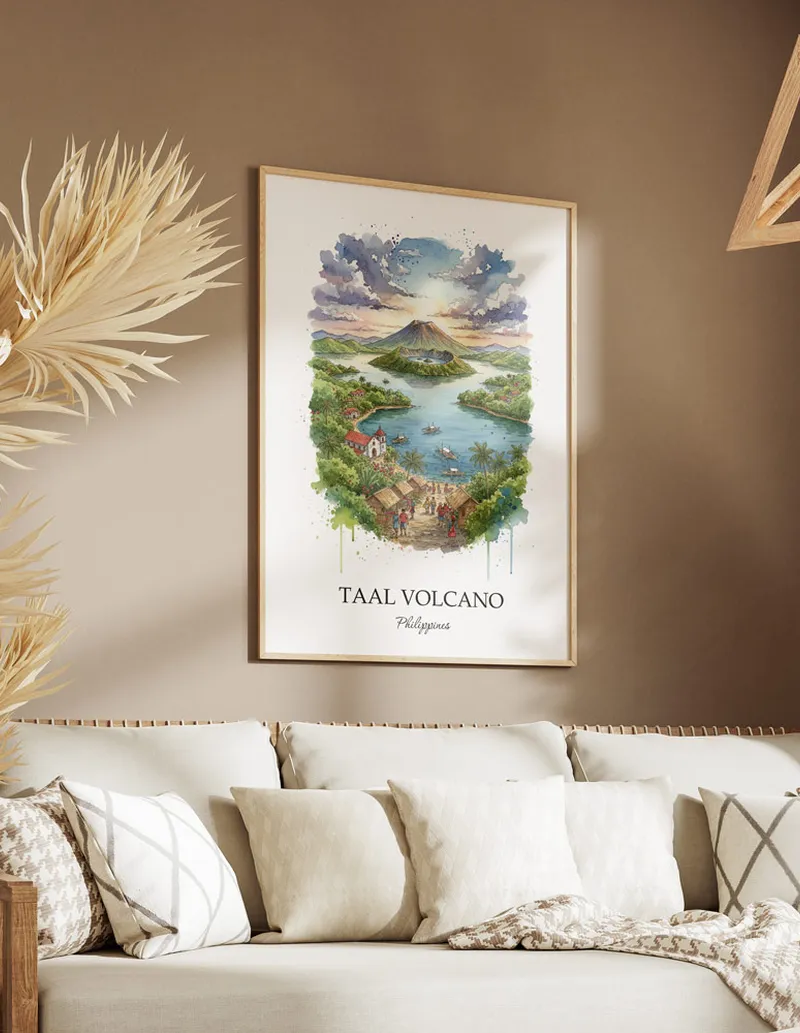 Framed wall art featuring Taal Volcano, Philippines in a light wood frame hanging above a sofa in a modern living room.