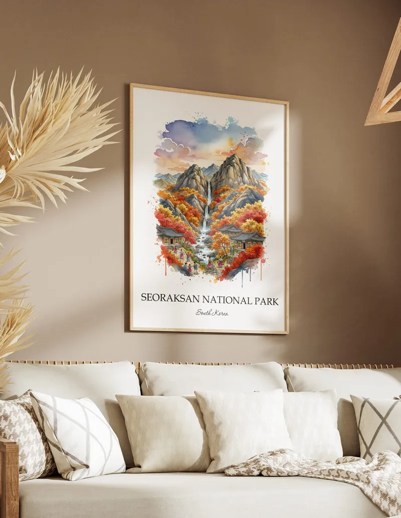 Framed wall art featuring Seoraksan National Park, South Korea in a light wood frame hanging above a sofa in a modern living room.