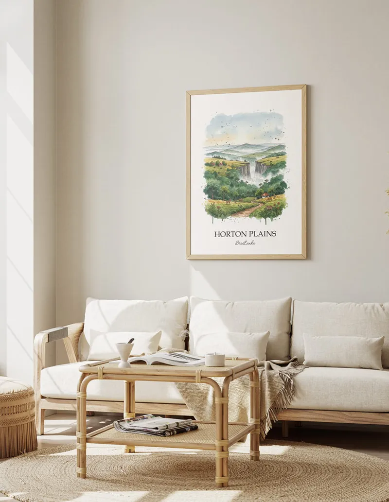 Vintage travel poster of Horton Plains, Sri Lanka in a light frame displayed above a sofa in a bright boho interior.