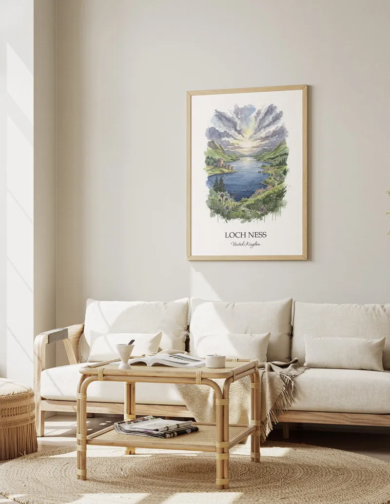 Framed wall art featuring Loch Ness, United Kingdom in a light wood frame hanging above a sofa in a modern living room.