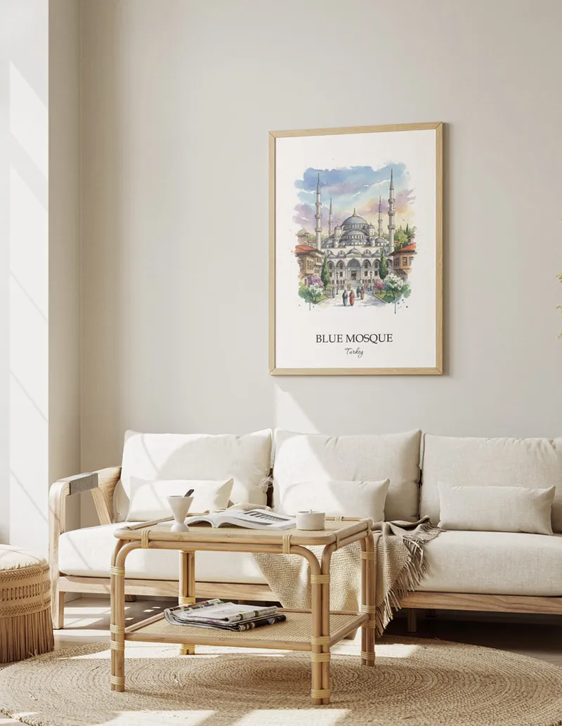 Vintage travel poster of Blue Mosque, Turkey in a light frame displayed above a sofa in a bright boho interior.