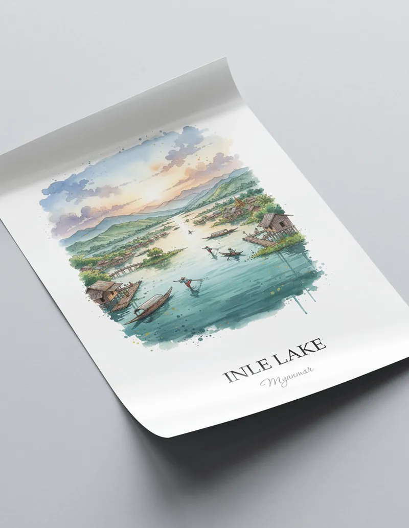Framed wall art featuring Inle Lake in Myanmar in a light wood frame leaning on the floor.