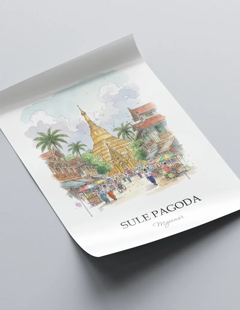Framed wall art featuring Sule Pagoda in Myanmar in a light wood frame leaning on the floor.