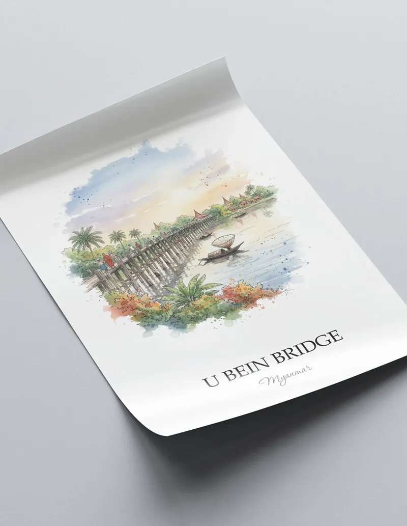 Framed wall art featuring U Bein Bridge in Myanmar in a light wood frame leaning on the floor.