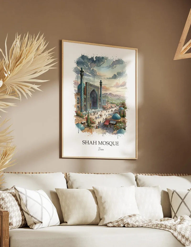 Vintage travel poster of Shah Mosque, Iran in a light frame displayed above a sofa in a bright boho interior.