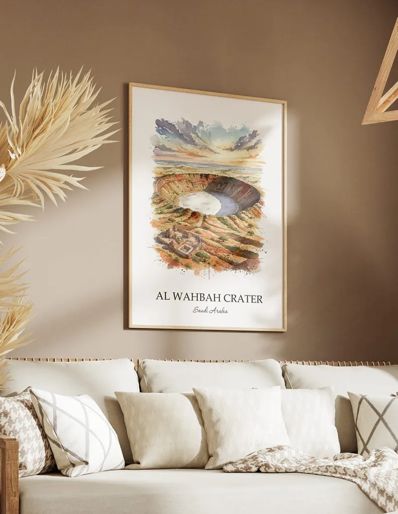 A gorgeous boho-inspired living space with a framed vintage travel poster of Al Wahbah Crater in Saudi Arabia on display.