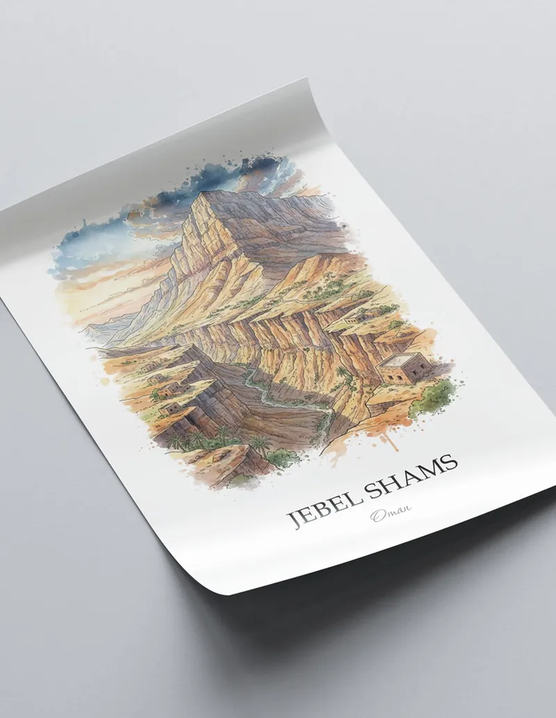 Framed wall art featuring Jebel Shams in Oman in a light wood frame leaning on the floor.