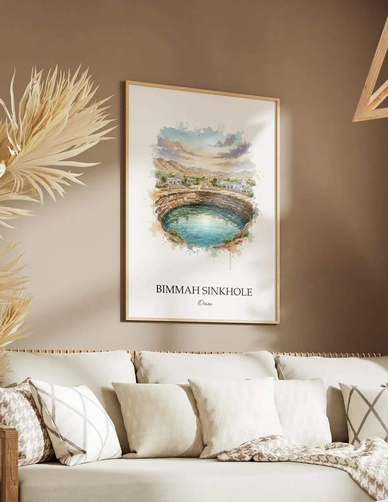 A gorgeous boho-inspired living space with a framed vintage travel poster of Bimmah Sinkhole in Oman on display.