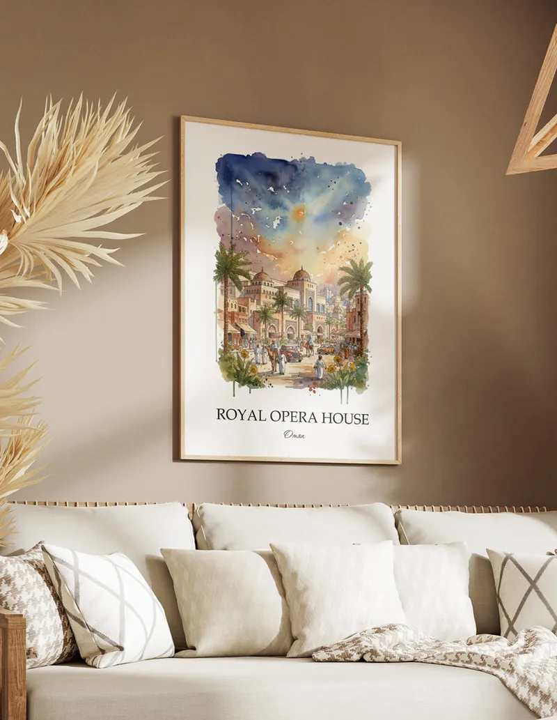A gorgeous boho-inspired living space with a framed vintage travel poster of Royal Opera House in Oman on display.
