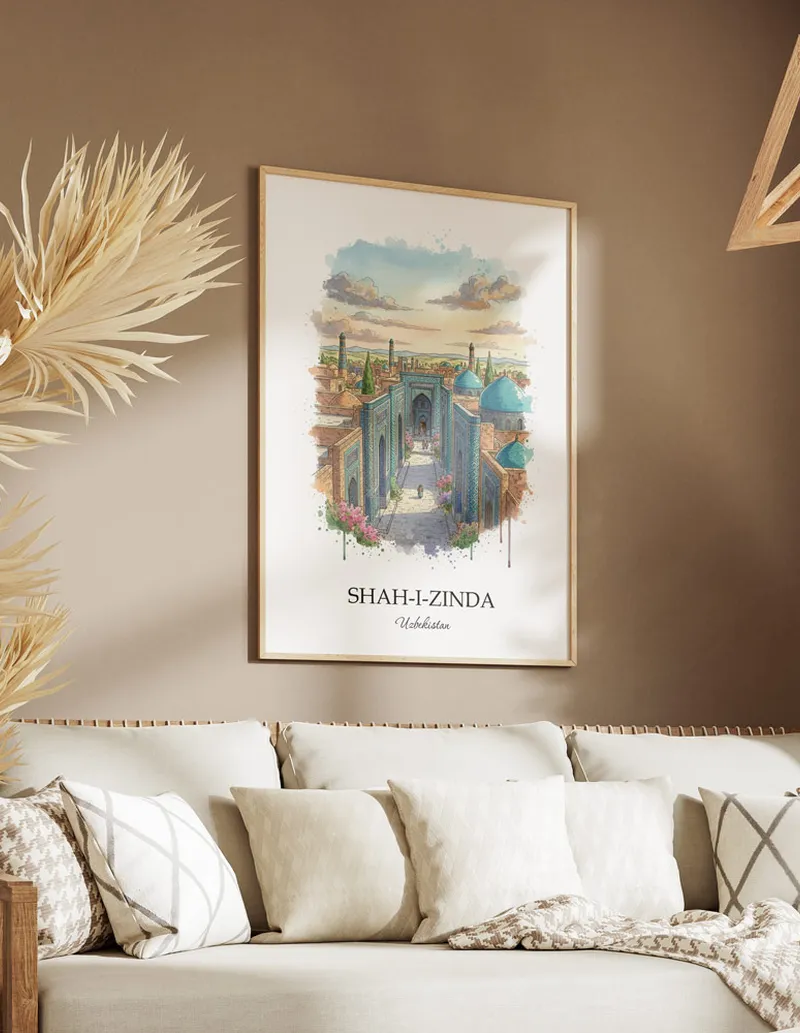 A gorgeous boho-inspired living space with a framed vintage travel poster of Shah-i-Zinda in Uzbekistan on display.