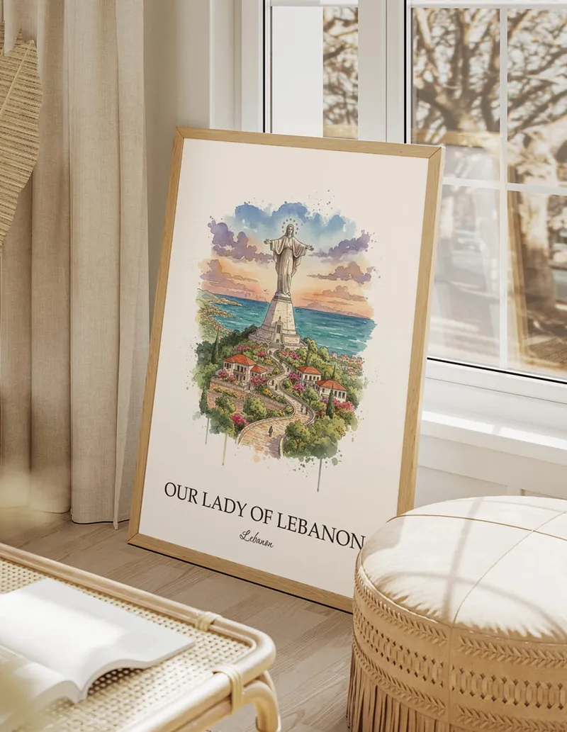 Framed wall art featuring Our Lady of Lebanon, Lebanon in a light wood frame hanging above a sofa in a modern living room.