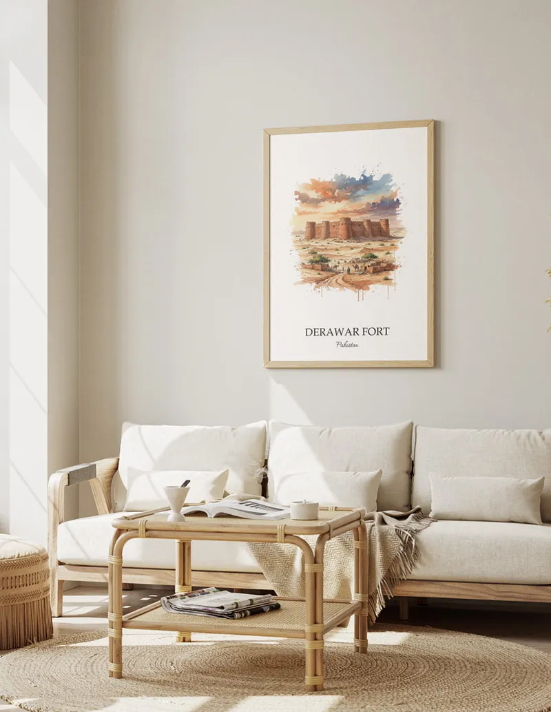 Vintage travel poster of Derawar Fort, Pakistan in a light frame displayed above a sofa in a bright boho interior.
