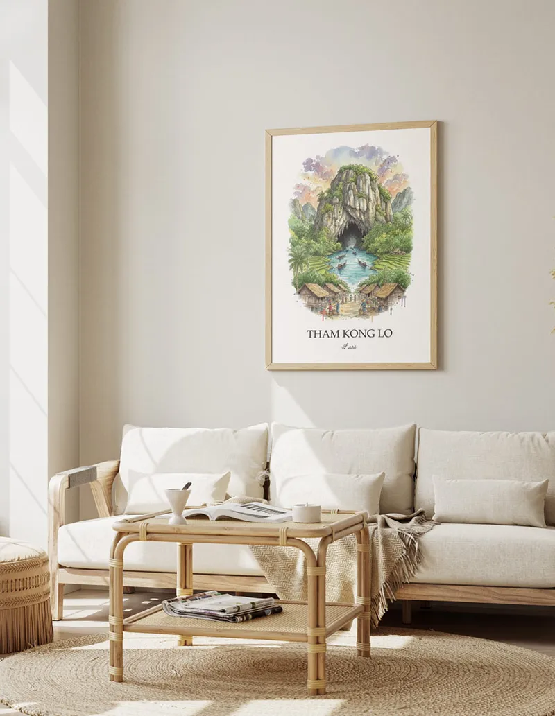 A gorgeous boho-inspired living space with a framed vintage travel poster of Tham Kong Lo in Laos on display.