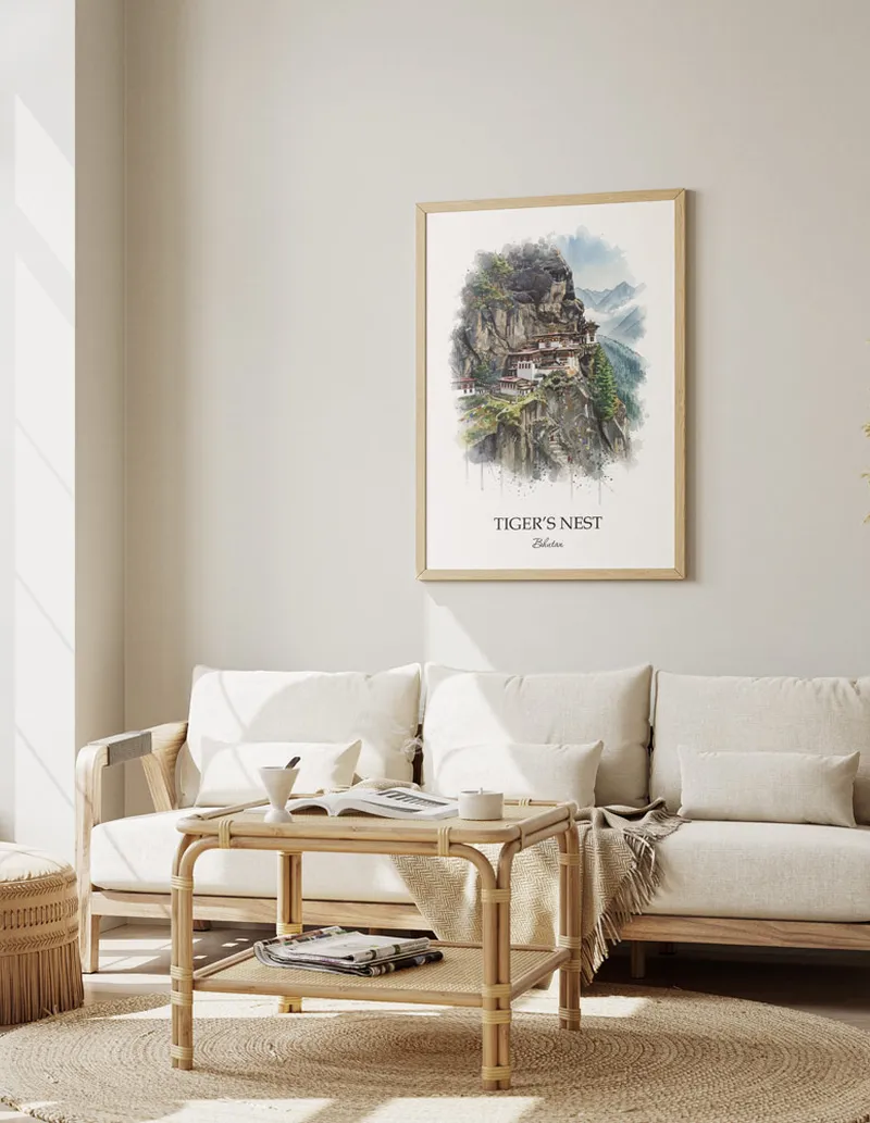 A gorgeous boho-inspired living space with a framed vintage travel poster of Tiger's Nest in Bhutan on display.