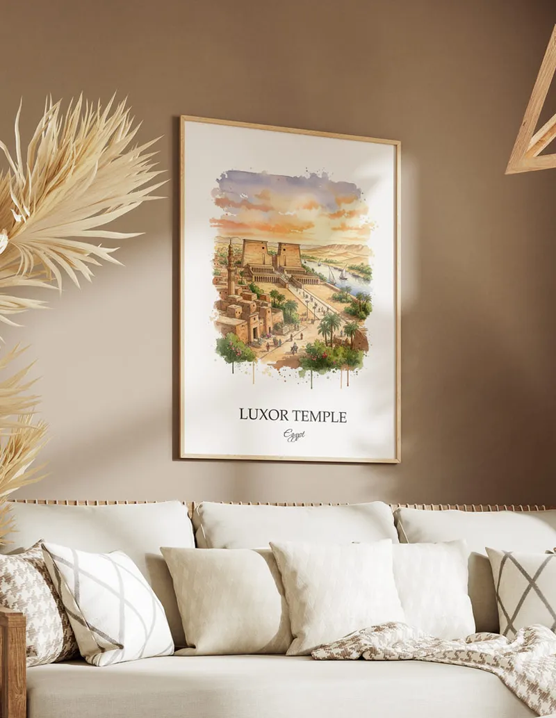 Cozy, well-lit workspace with a minimalist poster of Luxor Temple, Egypt in a light frame sitting on the desk.