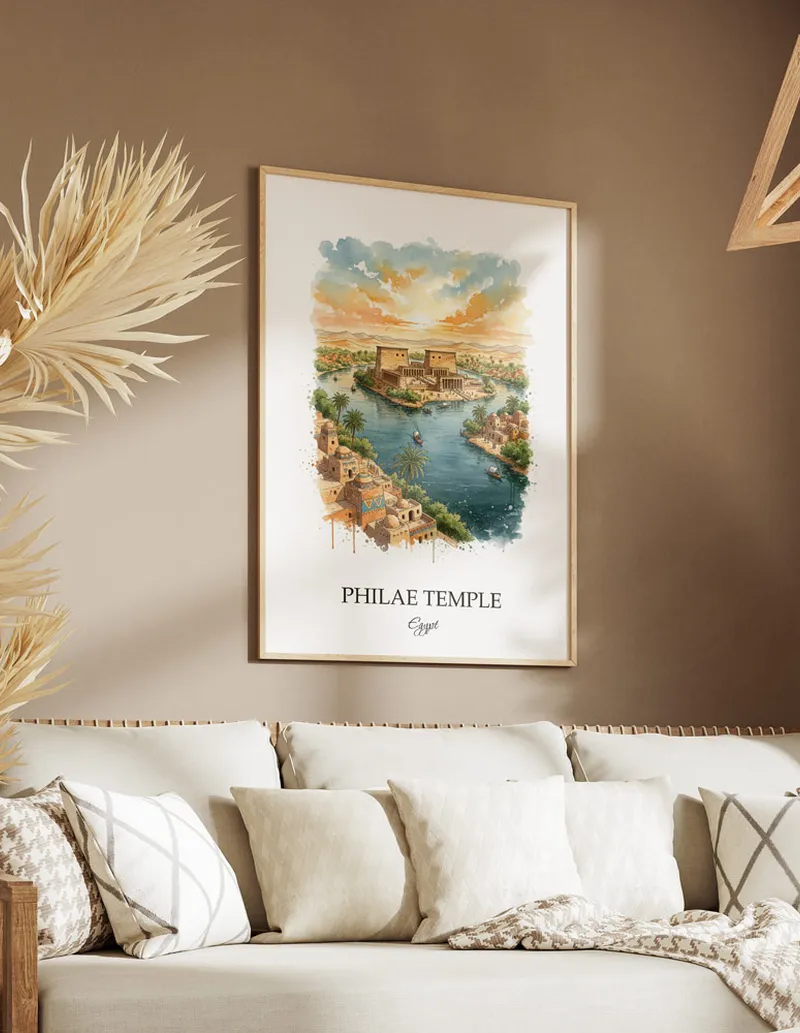 Cozy, well-lit workspace with a minimalist poster of Philae Temple, Egypt in a light frame sitting on the desk.