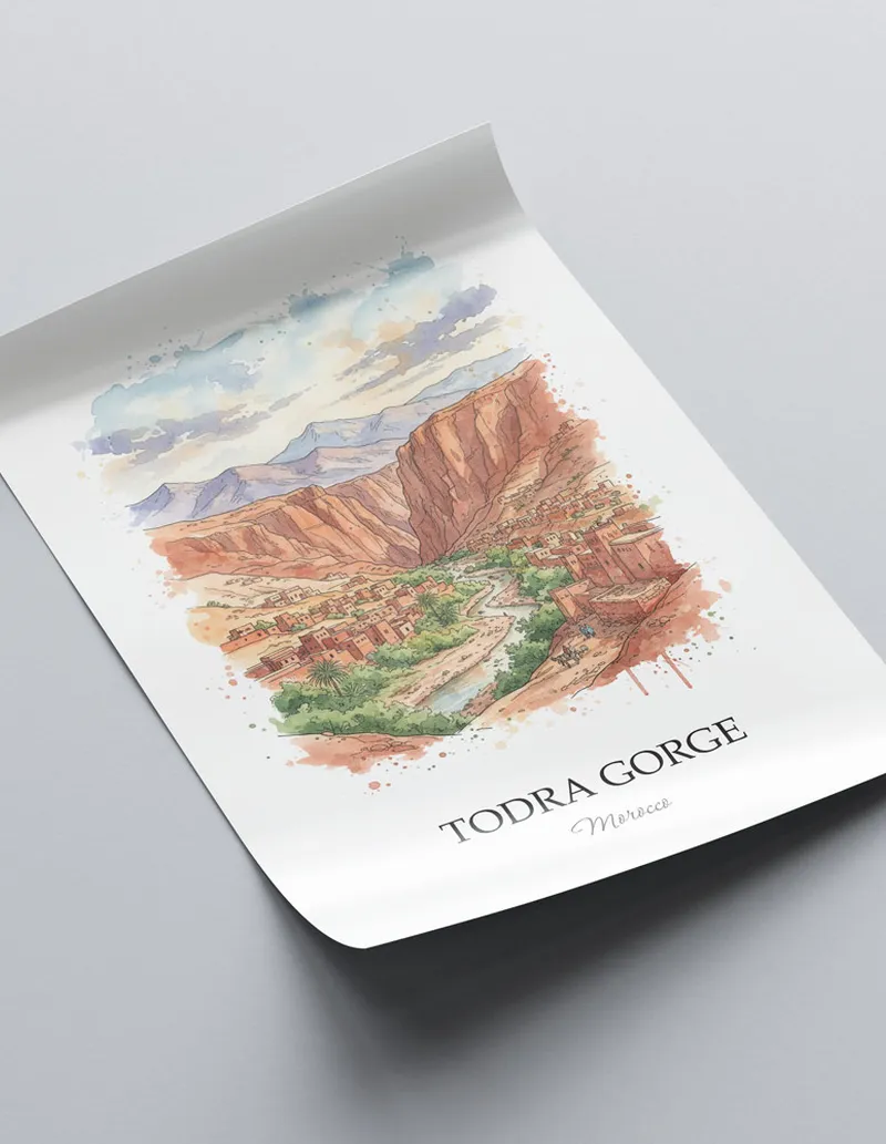 Minimalist poster of Todra Gorge in Morocco in a light frame standing on the floor in a dark moody interior.