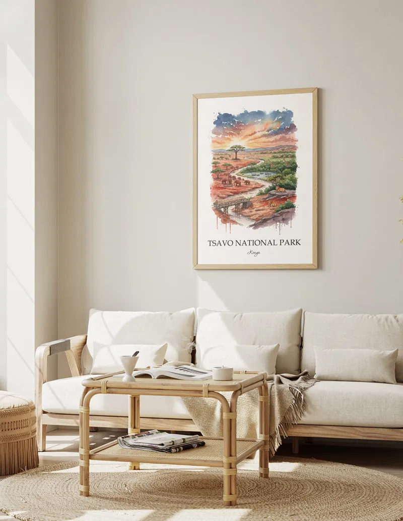 A gorgeous boho-inspired living space with a framed vintage travel poster of Tsavo National Park in Kenya on display.