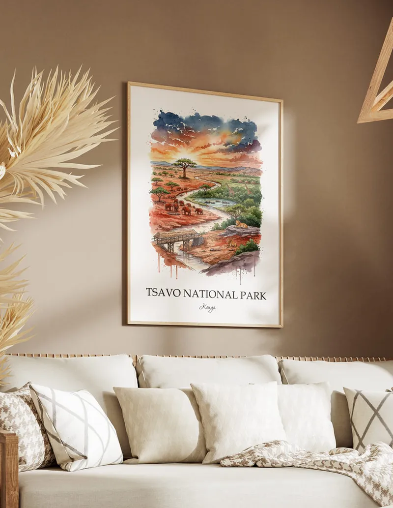 Cozy, well-lit workspace with a minimalist poster of Tsavo National Park, Kenya in a light frame sitting on the desk.