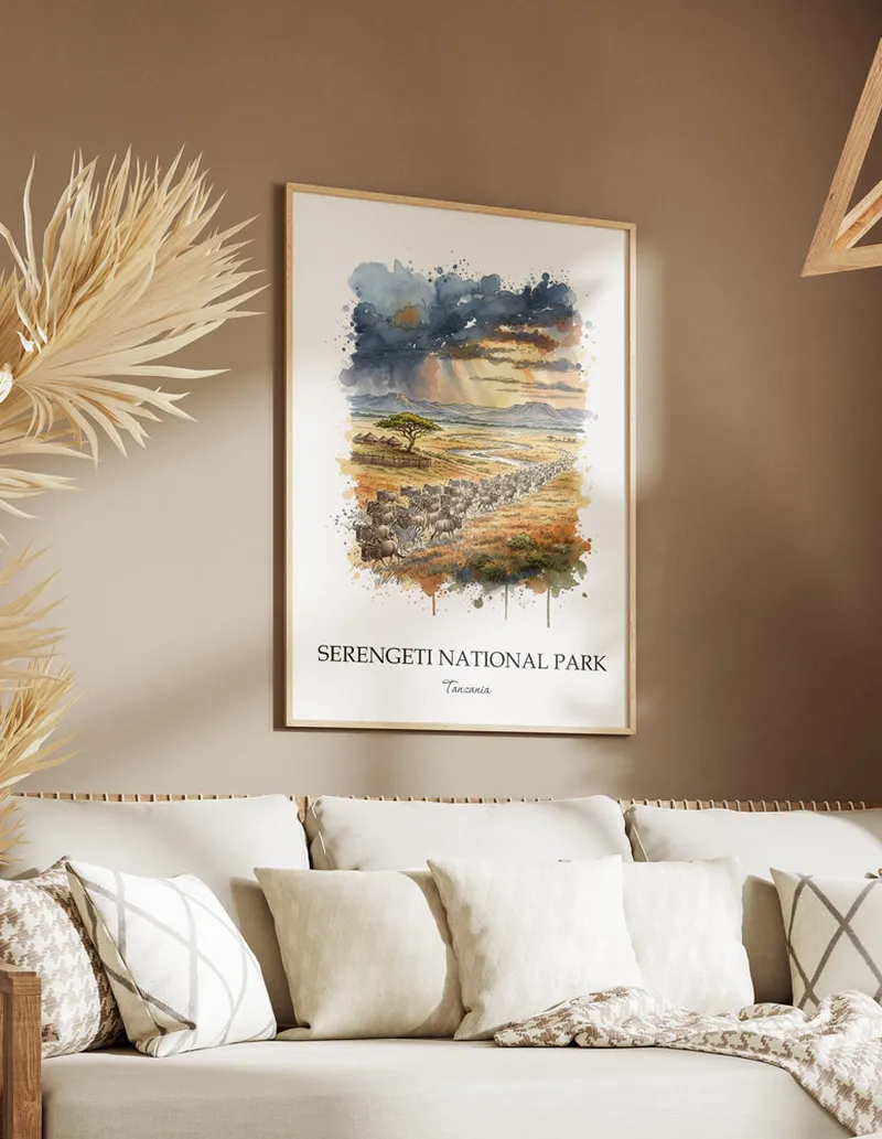 Cozy, well-lit workspace with a minimalist poster of Serengeti National Park, Tanzania in a light frame sitting on the desk.