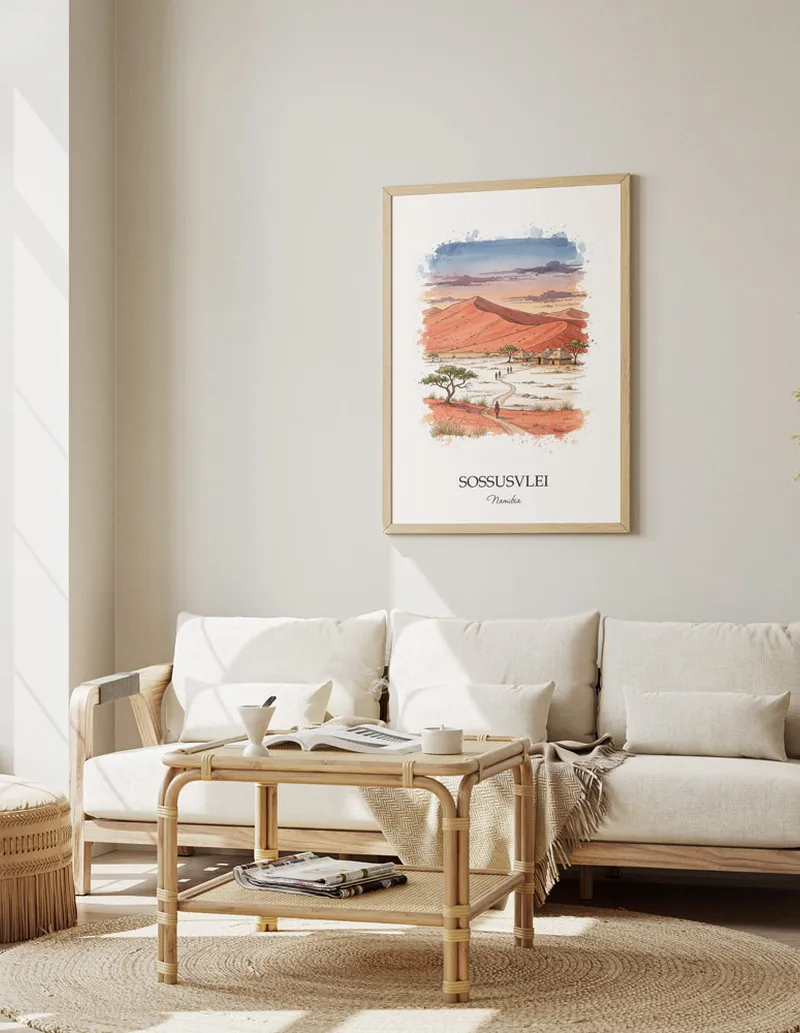 A gorgeous boho-inspired living space with a framed vintage travel poster of Sossusvlei in Namibia on display.