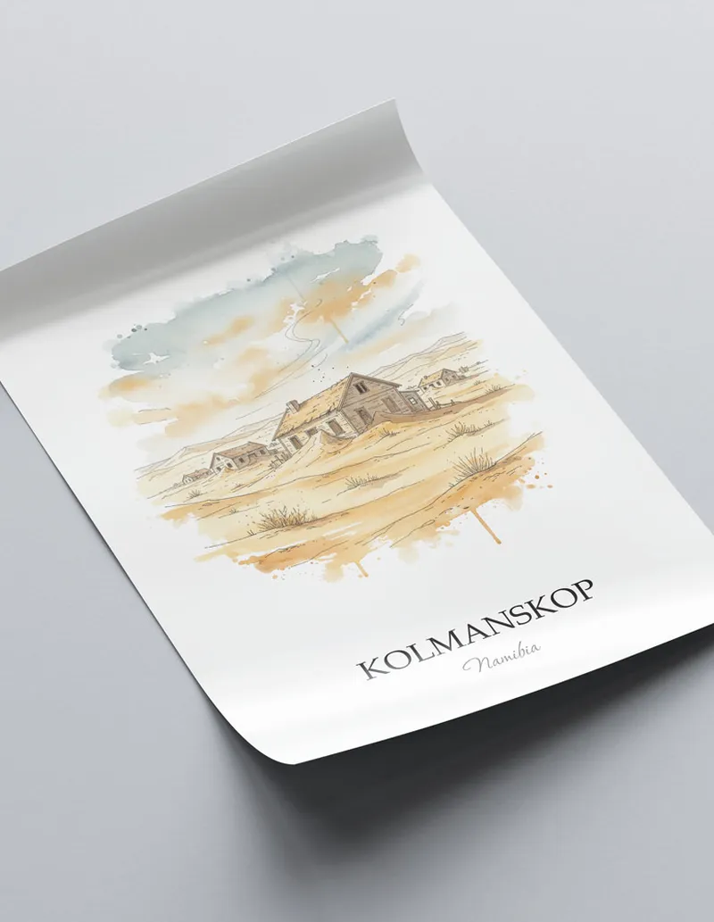 Minimalist poster of Kolmanskop in Namibia in a light frame standing on the floor in a dark moody interior.