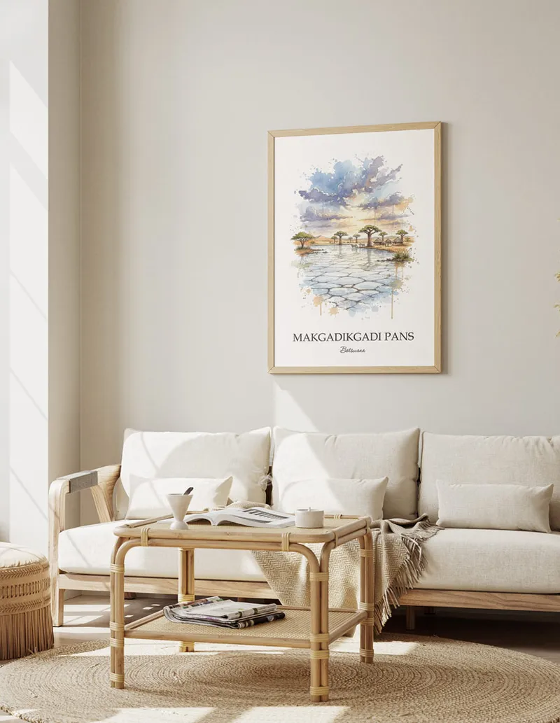 A gorgeous boho-inspired living space with a framed vintage travel poster of Makgadikgadi Pans in Botswana on display.