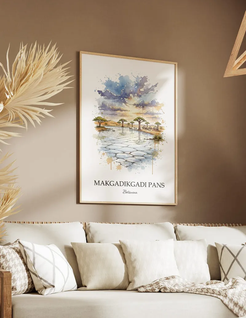 Cozy, well-lit workspace with a minimalist poster of Makgadikgadi Pans, Botswana in a light frame sitting on the desk.