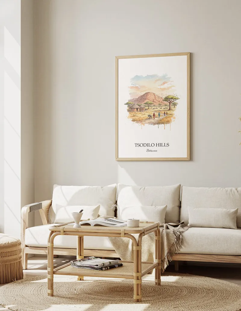 A gorgeous boho-inspired living space with a framed vintage travel poster of Tsodilo Hills in Botswana on display.