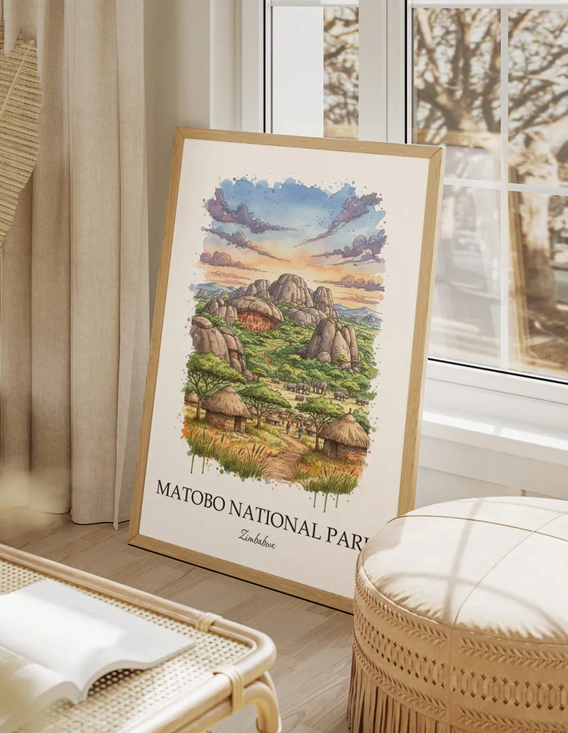 A gorgeous boho-inspired living space with a framed vintage travel poster of Matobo National Park in Zimbabwe on display.