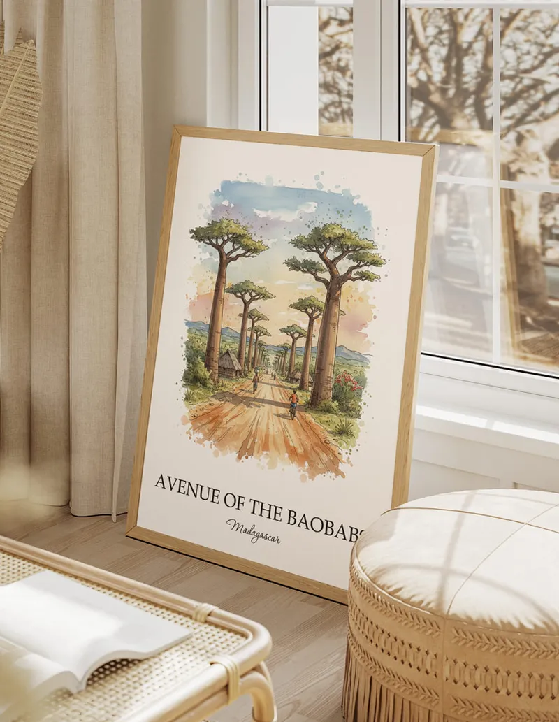 A gorgeous boho-inspired living space with a framed vintage travel poster of Avenue of the Baobabs in Madagascar on display.