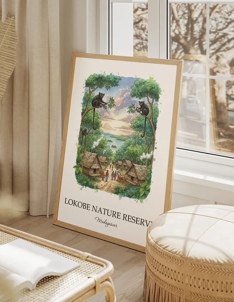 A gorgeous boho-inspired living space with a framed vintage travel poster of Lokobe Nature Reserve in Madagascar on display.