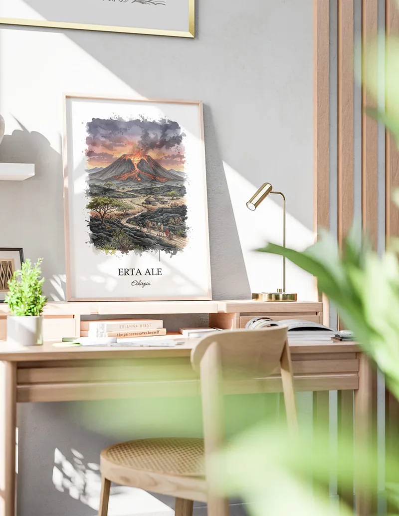 Framed wall art featuring Erta Ale in Ethiopia in a light wood frame leaning on the floor.