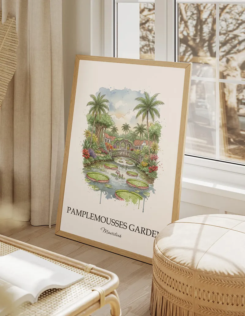 Framed wall art featuring Pamplemousses Garden, Mauritius in a light wood frame hanging above a sofa in a modern living room.