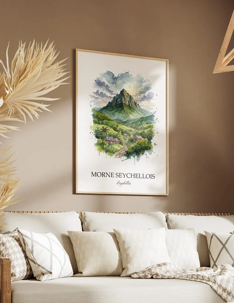 A gorgeous boho-inspired living space with a framed vintage travel poster of Morne Seychellois in Seychelles on display.