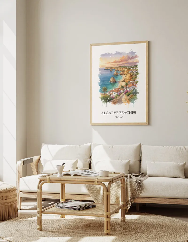 Framed wall art featuring Algarve Beaches, Portugal in a light wood frame hanging above a sofa in a modern living room.