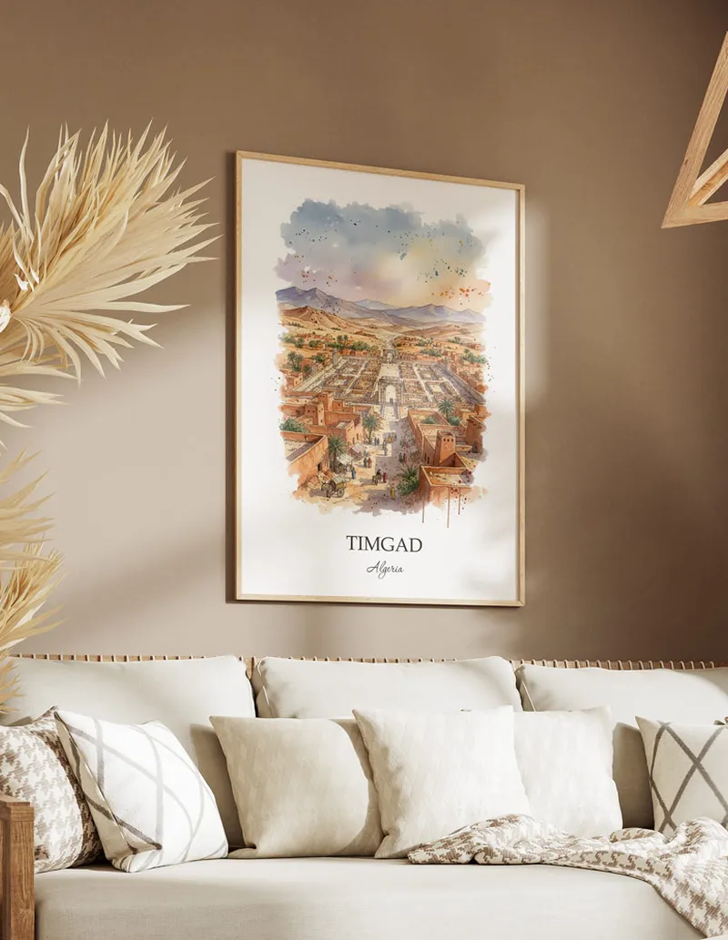 A gorgeous boho-inspired living space with a framed vintage travel poster of Timgad in Algeria on display.